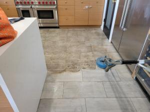 Gray tile, grout cleaning wand, before and after