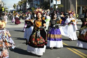 Proud dancers in the traditional costumes of the Mexican State of Michoacán—the birthplace of the celebration of the Day of the Dead