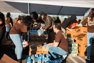 Volunteers prepare to distribute groceries at Eat & Be Well 2021