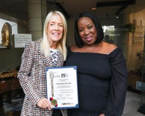 Beverly Hills Mayor Lili Bosse presents a Certificate of Recognition to Gloria L. Williams, owner of Footnanny Foot Spa at the official grand opening ribbon cutting ceremony at the Rodeo Collection. Photo: Sheri Determan