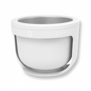 Image is of CIRO, a circular cleaning appliance with a stainless steel bowl and a white biodegradable shell.