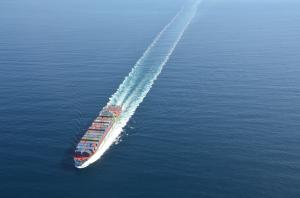 ship in ocean from above showing containers