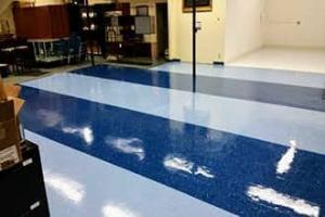 Shiny blue VCT tile just after professional floor waxing