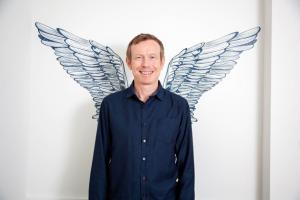 Image of Enshored CEO Ian Jackson with wings logo
