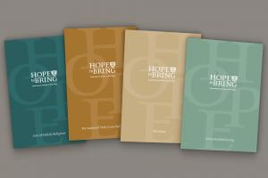 Image of four literature covers that used a typographic design placed over muted background colors.